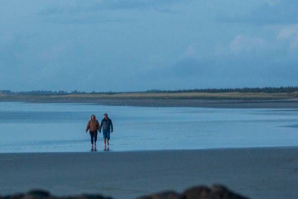 Long Beach WA is a perfect destination for romantic getaways Couple walking on the beach