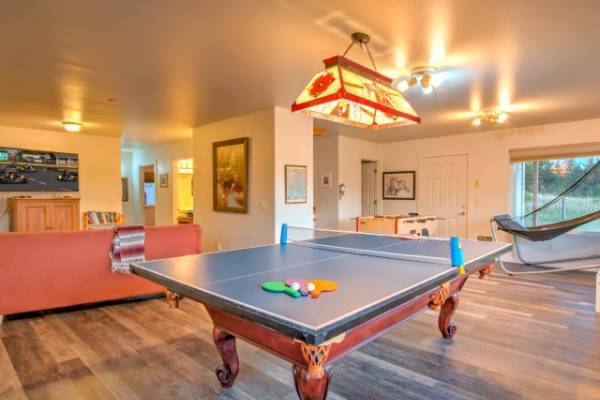 Photo of recreation room with pool table and ping pong table top