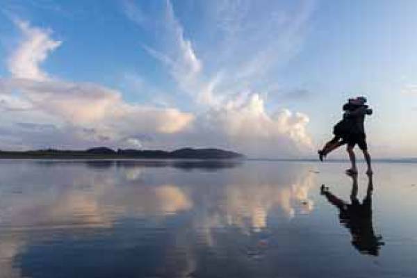 Couple hugging on the beach