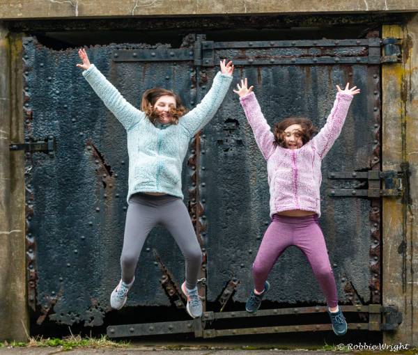 Fort Canby is a wonderful place for children to explore Fort Canby State Parkig two children jumping with joy
