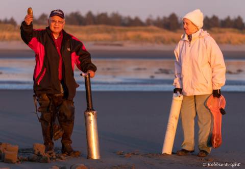 Long Beach Razor clam digging Couple Showing their catch from the Clam Dig