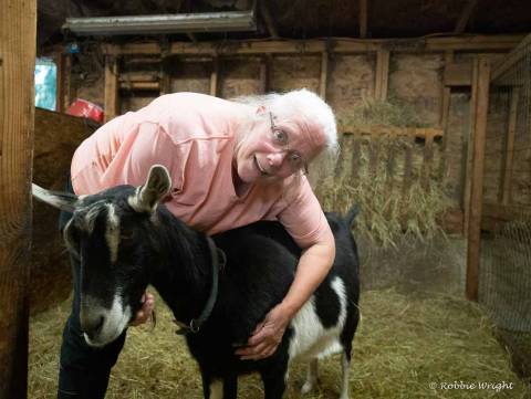 LJ Ranch is fun for the entire family Woman hugging a goat