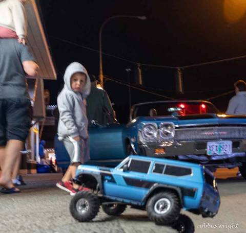 Child looking at Toy Car at the car show