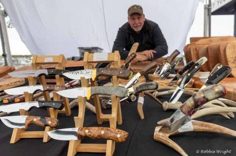 Saturday Market in Ilwaco Washington Man selling knives