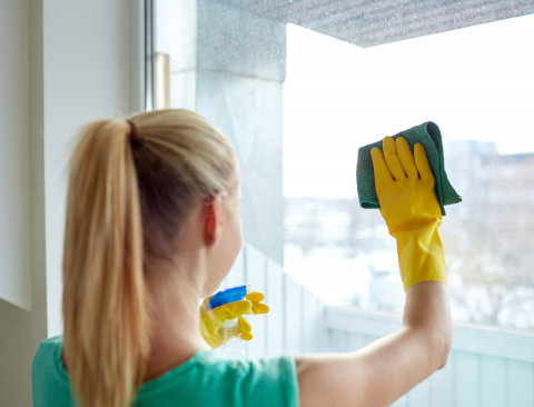 Housekeeper cleaning window Housekeeper cleaning window