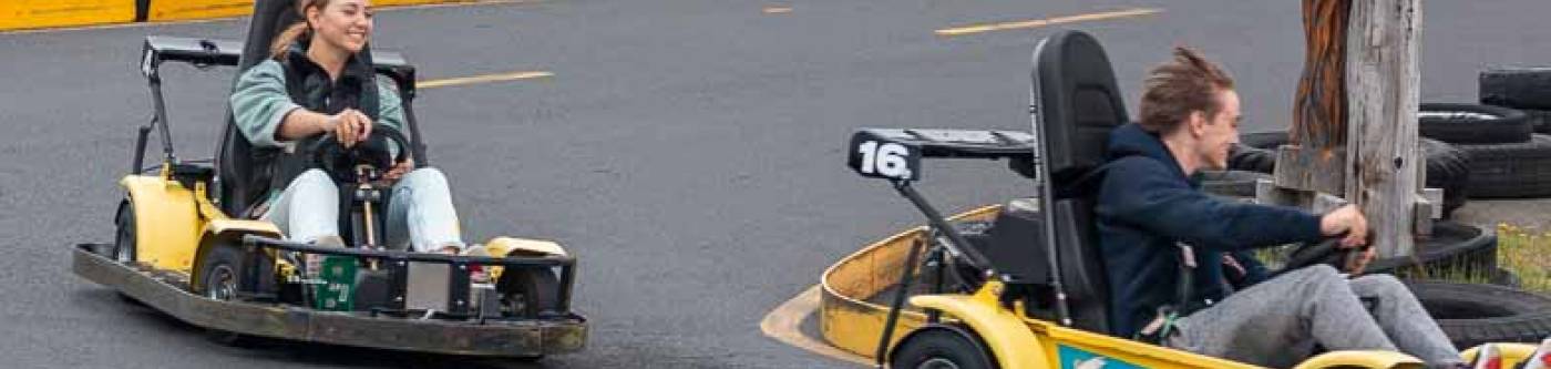 Teenagers riding go karts in Long Beach, Washington