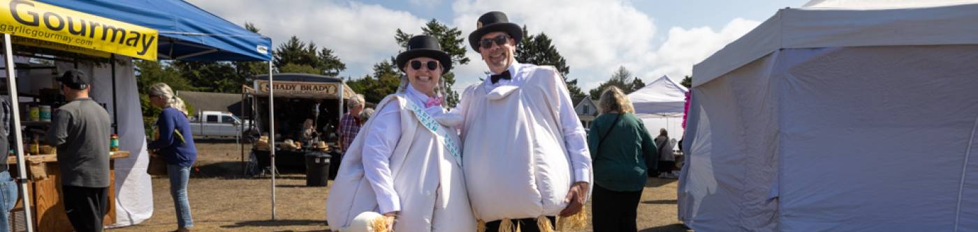 Couple dressed in garlic costumes